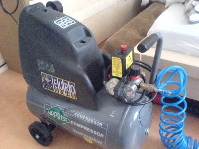 The air compressor in its full glory.<br />The yellow warning label reads:<br />WARNING!<br />Pressure controls set at factory for maximum safe operation. DO NOT ADJUST FACTORY SETTINGS!<br />But lets pretend the label wasnt there. :)