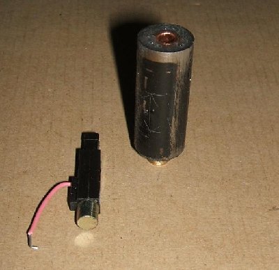 Cartridge v2 curing with a piezo ignitor for scale, the scratched arrow markings indicate the effective internal volume.