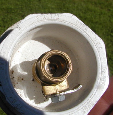 Close up of the trigger inside a 2 inch threaded plug makes this launcher valve serviceable.  This like the Mouse Musket has a 2 inch pipe inside the Female Adapter to act as the piston cylinder.