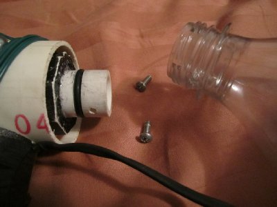 The method of attaching the bottle, a 1/2&amp;quot; pipe stub with an o-ring installed and two holes for #6-32 machine screws.