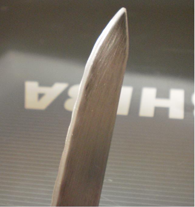 the blade. it only sharpened on one side with a bench grinder