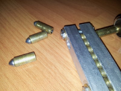 Mag and ammo 6mm copper tubes cut and then studs epoxied on. I think they look cool haha