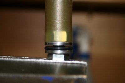 Piston detail. The threaded rod has two flats filed into it to allow air to flow past the nut.