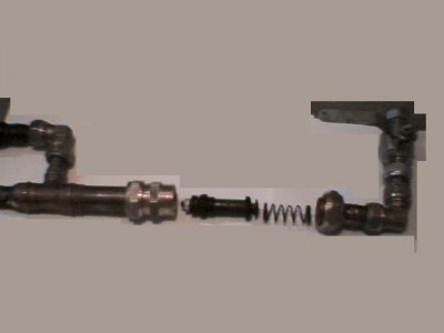 The back of the gun, the 22mm compression joint is for access to the piston and spring