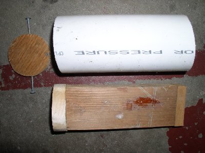 here is my snow compressor. The nails hold the stopper plate in the bottom and the piece of paper board on the end is to stop the wood from getting all mangled. the projectiles end up quite hard.