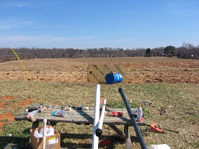 this is my sideyard and shhoting gallery... the crest of the hill where you see the farthest phone pole is .258 miles, all my golf balls went well beyond that when fired at about a 15 degree angle, I'm pretty sure they ended up in the pond 300 yds beyond the hill, cause they ain't been found...