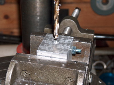 Remove the blocks, line them up, bolt them together. Then put them back in the vise, BOTTOM up. Drill a shallow hole DEAD CENTER as shown. 3/16&amp;quot; is plenty deep. The success of the mold hinges on this shallow hole, being lined up perfectly, so take your time, and get it right.
