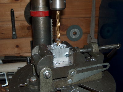 Start drilling. Go in steps of drill sizes depending on what you have. Take no more than 1/4&amp;quot; steps though. Use WD-40 as cutting fluid, and keep the bit and bottom of the hole wet.