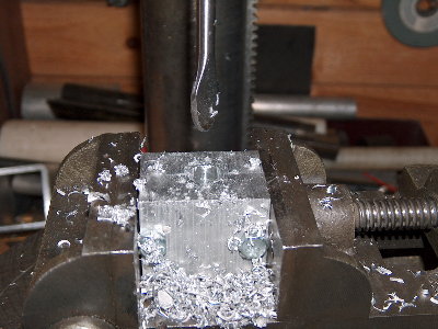 Running at 500rpm, with a LOT of WD-40, the modified spade bit cut aluminum surprisingly well. Better than I expected.