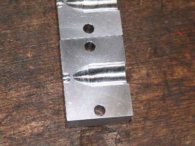 The wavy reflections on the machined surface indicate that the bit was wandering a little. A more sturdy machine and slower feed rates should make for an improvement.