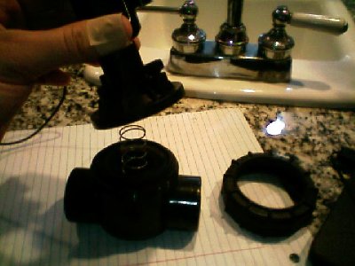 screw top is off, solenoid and bleed valve all come off in one chunk... leaving diaphragm, spring and the guide rod or whatever its called...