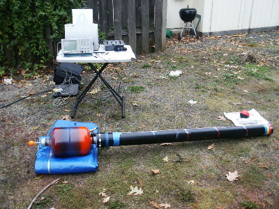 4 inch barrel test setup.  Foam ball, barrel with pick up coils, coil pre-amp, scope, printer.