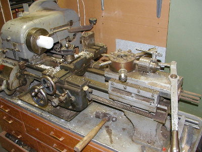 My Dad's lathe.  Configured for production cutting of bolts, etc.  Turrent tailstock and leadscrew transmission for most common thread pitches.