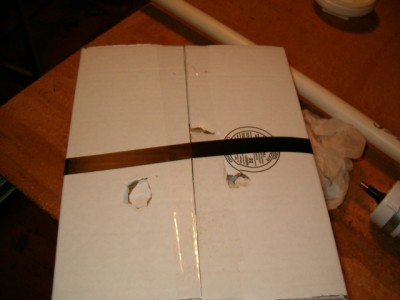 Damage to a cardboard box.