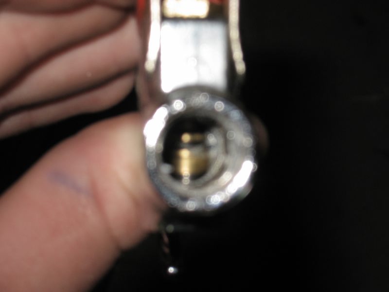 With the bigger hole drilled through the 'chamber port' of the blowgun and the plastic added under the handle, the valve opens with more flow