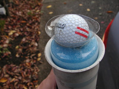 This sabot slides freely in a thin wall tennis ball barrel. Here it is held by the slight shrinkage at the modified muzzle.