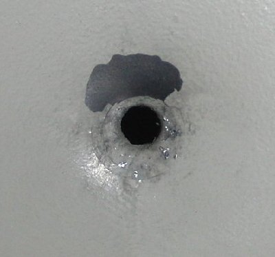 entry hole with saboted 0.177&amp;quot; BB, note that some flecks of foil from the sabot are visible next to the hole