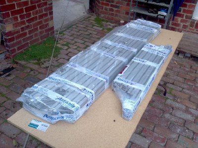 As delivered, lots of tape and shrink wrap. The big parcel weighs about 30kg so still easy to handle