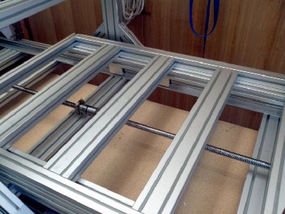 Like it says, table on rails. The 1600mm rods and the offset bearings allow the 1000mm table to slide completely under the gantry meaning I will get my full cut area.