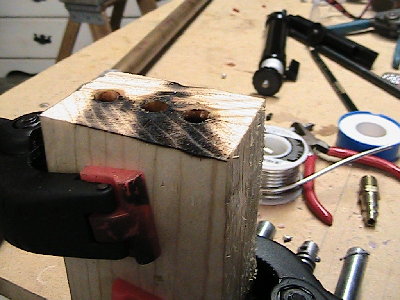 IMG_0336.JPG (243.56 KiB) Viewed 4562 times two blocks of wood with appropriate holes in them. (lube holes before use)