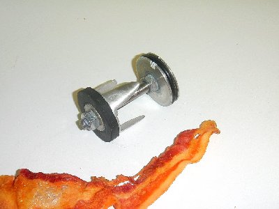 Stainless and aluminum, floating oring. This was made with a hand drill before I got my drill press. And it was very intimidating sanding it down by hand while it was whirling away at 2000rpm.