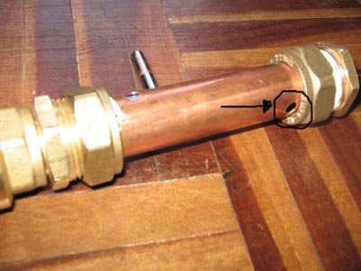 Note the small hole where the trigger will lock the bolt in place.