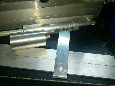 The hammer is re-cocked while the piston is pushed backwards and will be caught by the trigger mechanism which is intended for semi-auto operation.