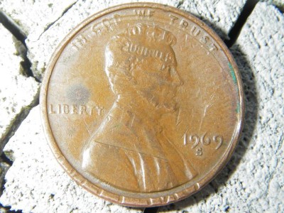 This perticular penny has an imprint of the backside of another penny on it. Check out his forehead.