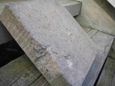 This concrete block is 11inx11inx2.5in and was shot with paintball size ballbearings