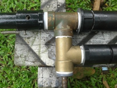 the top brass T for the piston valve housing