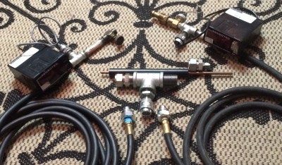 Here is the fuel system.  The hose on the left will have an air qc fitting installed.  Hose on the right is propane. 0-250 1% transducer on air, 0-30 .25% on propane.  The large tee connects to the chamber, the black rod serving as the high voltage feed through for ignition.  The two compression fittings will make the seal.  The qc fitting on the tee is rated to 10k psi so should serve well with only 1000psi combustion pressure.