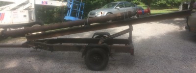 Beam for slide and chamber on trailer