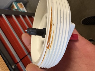 Singe at end cap threads where igniter located