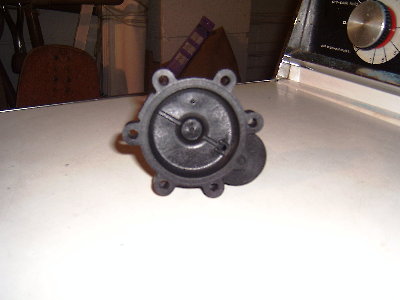 Photo 2. View of sprinkler valve cap. The port to where the solenoid used to be has been bored out to 4ml.