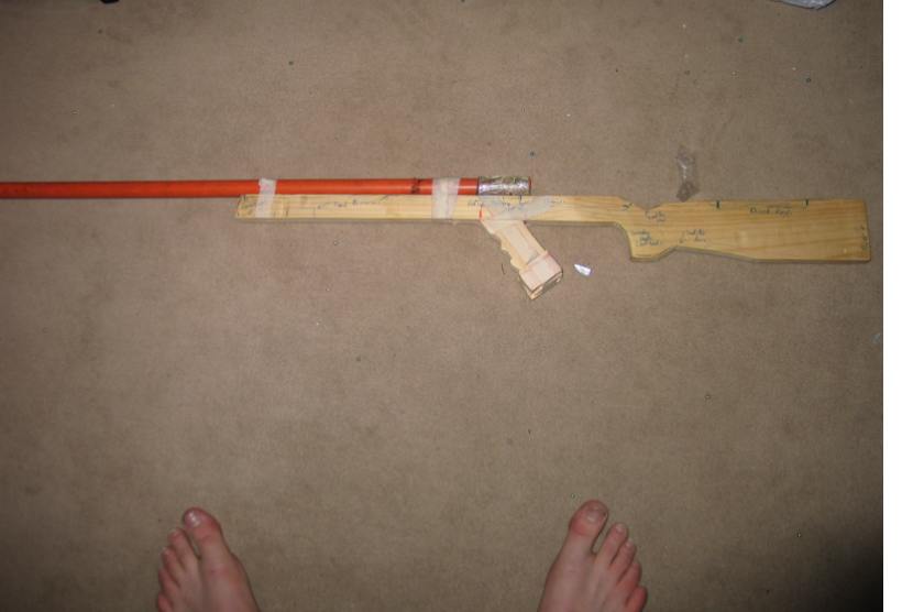 This is it on Day one of work and is only one third done.I've taped the pistol grip and barrel to it too see what it would look like.<br />(THis is before the chamber and other parts came)