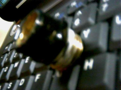 The fitting that WAS epoxied to the bottle.Epoxy cracked when it dried..