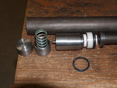 Rear plug w/spring seat, spring and hammer, Hammer valve, piston, ring to be sectioned for centering of barrel, Quad ring